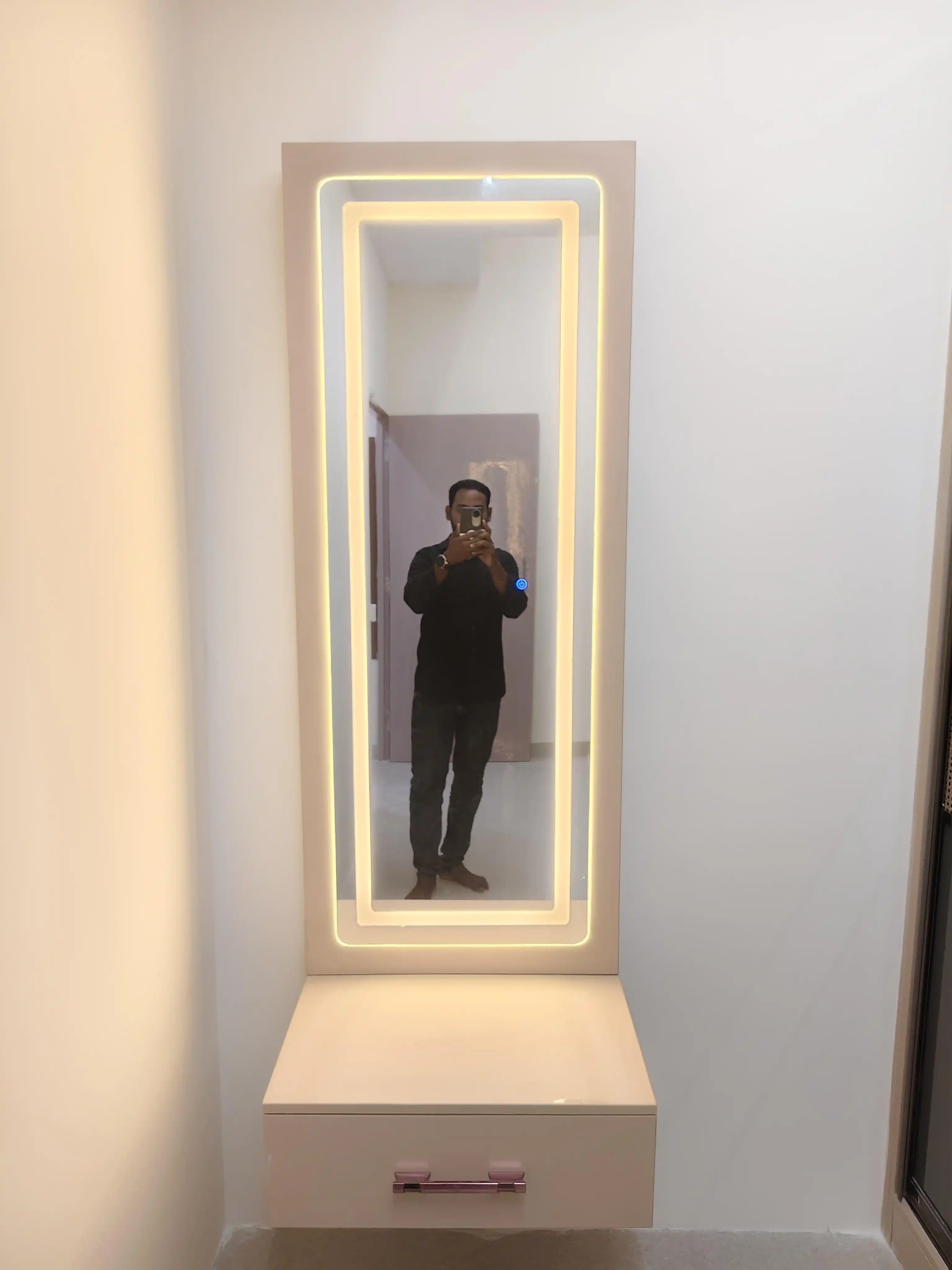 Mirror and wall detail in warm minimal home
