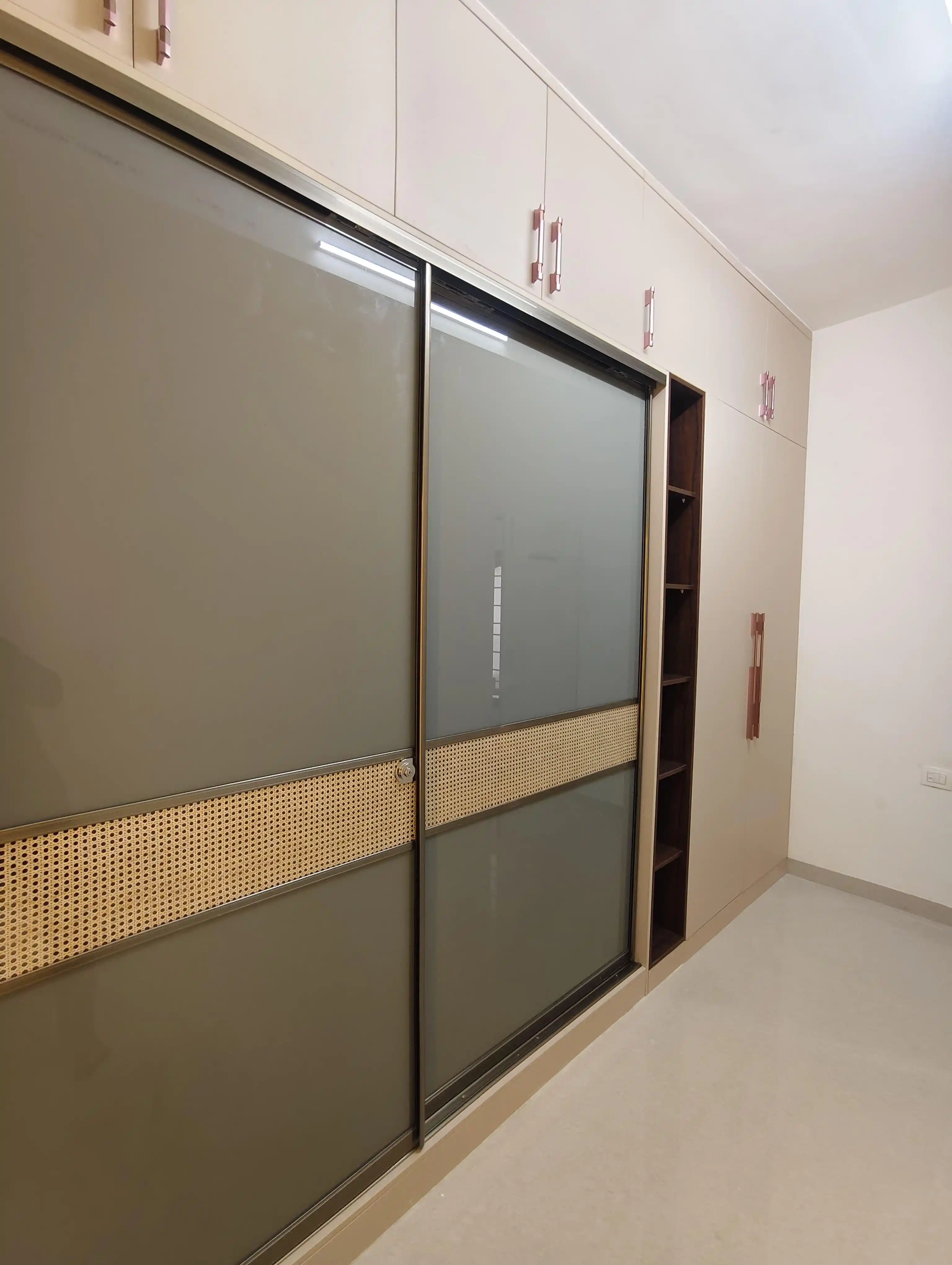 Sliding door wardrobe design in Tambaram home