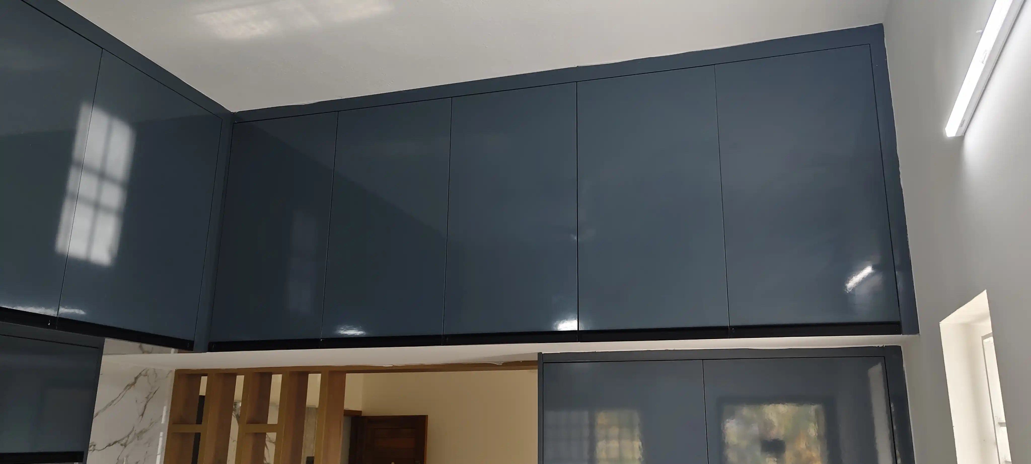 Kitchen overhead storage and lighting detail